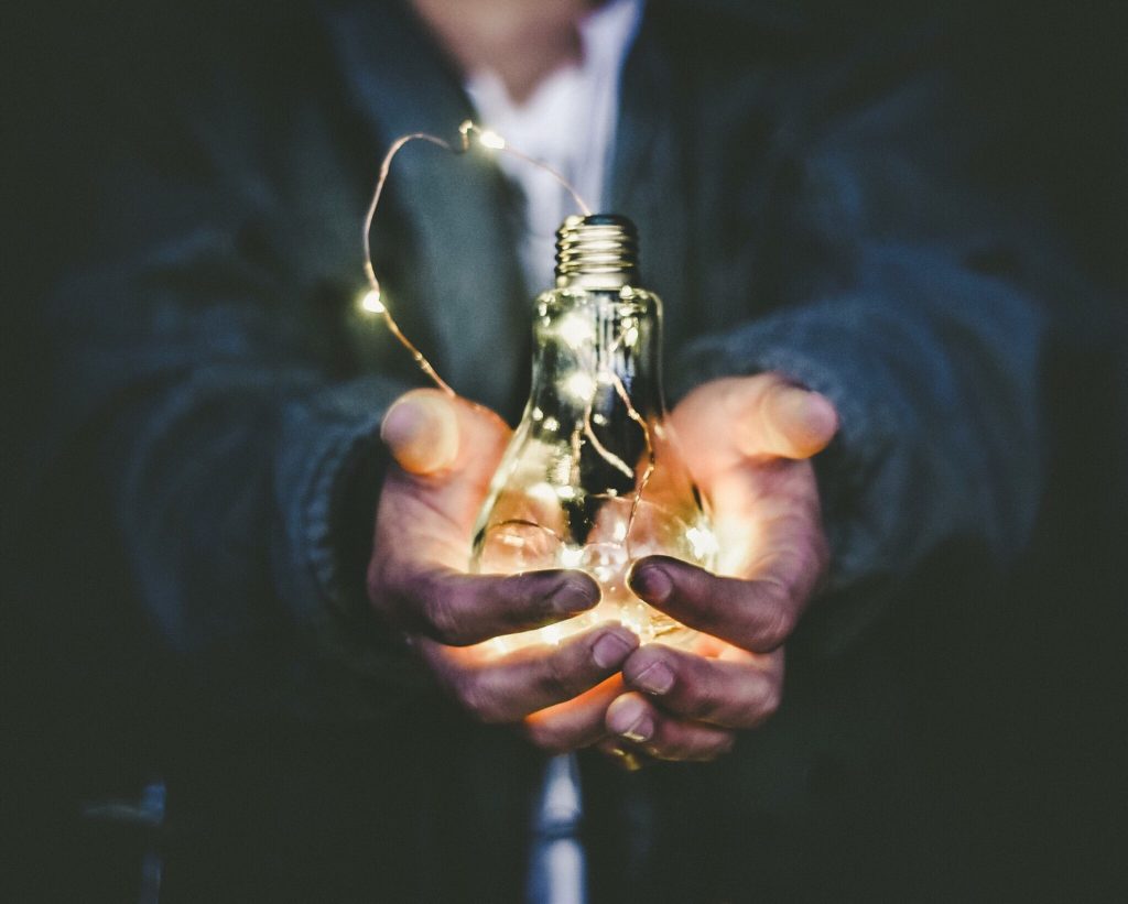 lightbulb held in hands