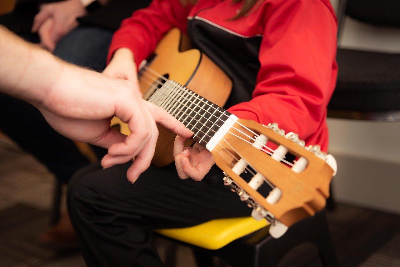 Guitar being taught