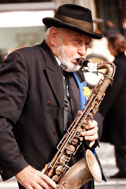 Playing Saxophone by Vera Kratochvil, Public Domain, via PublicDomainPictures