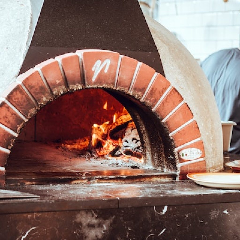 Red brick rounded beehive pizza oven.