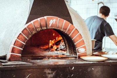 Red brick rounded beehive pizza oven.