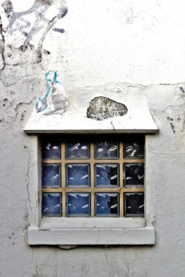 dripstone hanging from the top of a window.