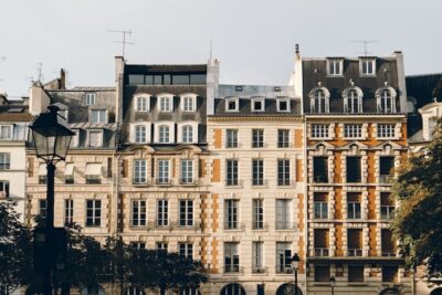 Facade of four European buildings.