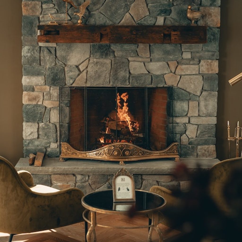Fireplace with stone and wood mantle.