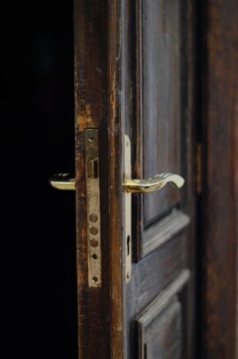 Brown door with a gold door jamb