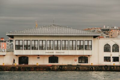 Two story building next to a shore