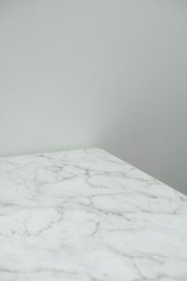 White marble with gray veins against a gray-white wall