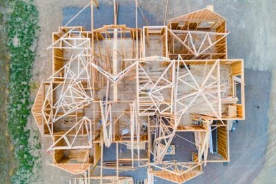 Aerial view of the wooden structure of a home being built