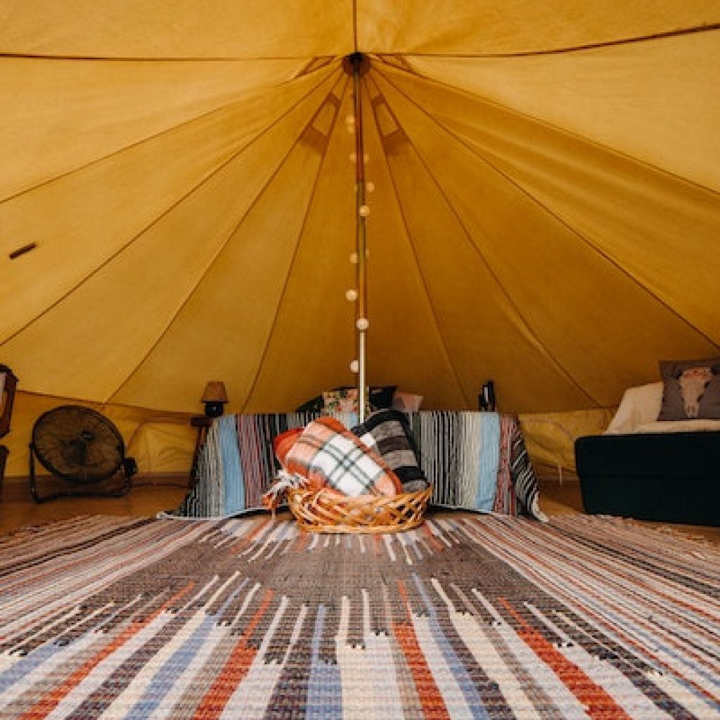 interior of a tent with a large carpet all around