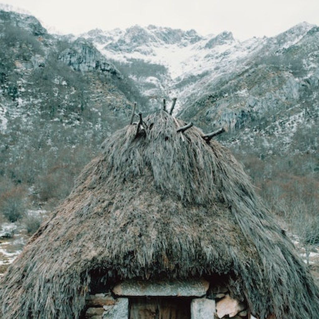 Tent like structure with a door in the middle of the mountains
