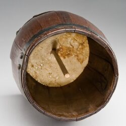 View of a Brown Wooden Friction Drum from underneath