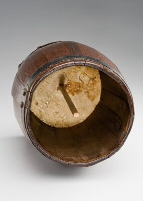 View of a Brown Wooden Friction Drum from underneath