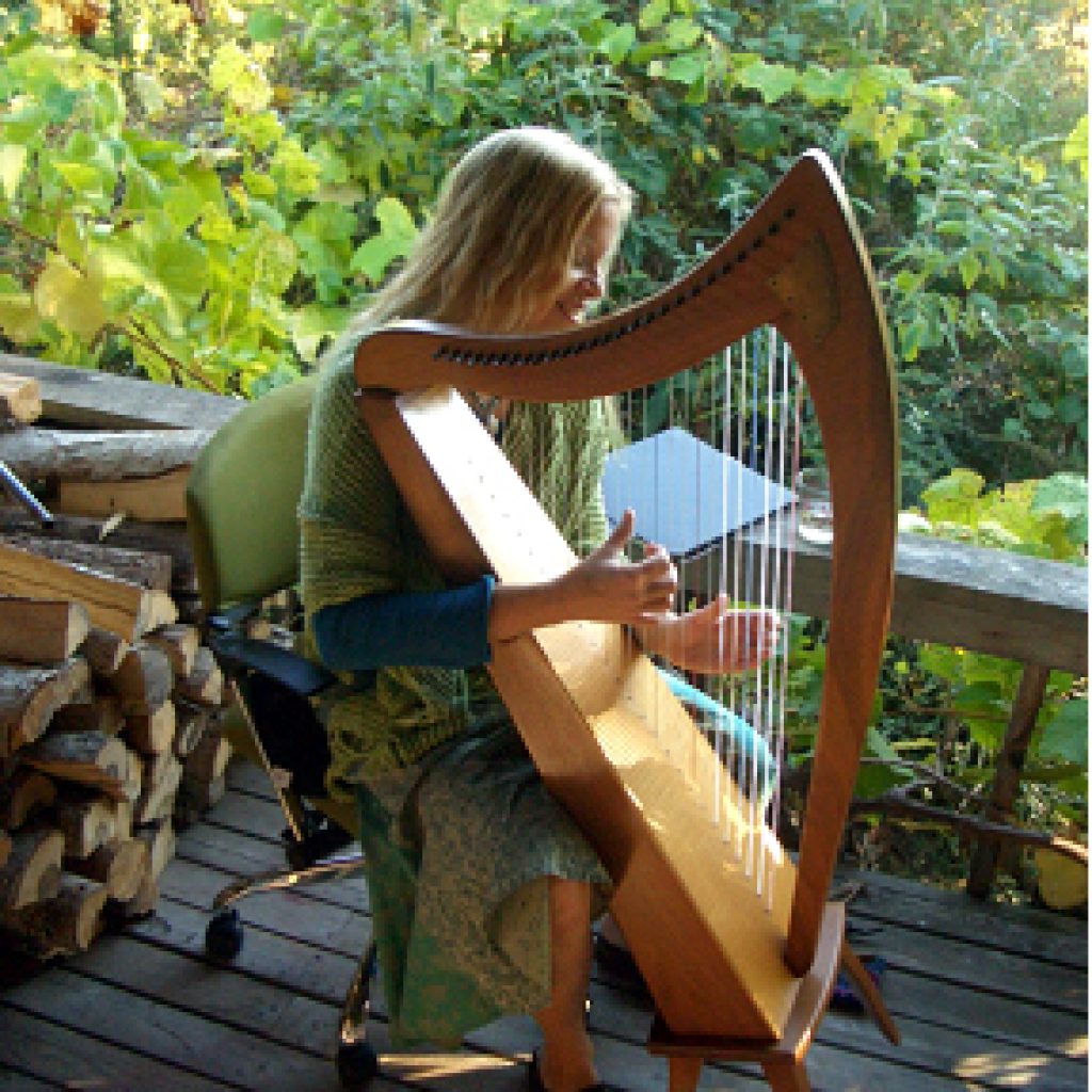Harp being played by a woman