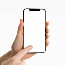 Photo of finger pointing to a mobile phone